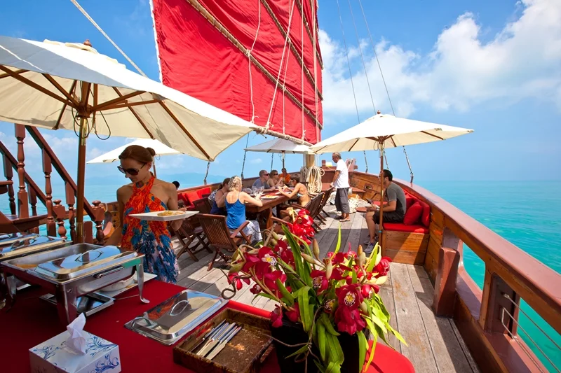 Guests enjoying buffet dinner on Red Baron yacht